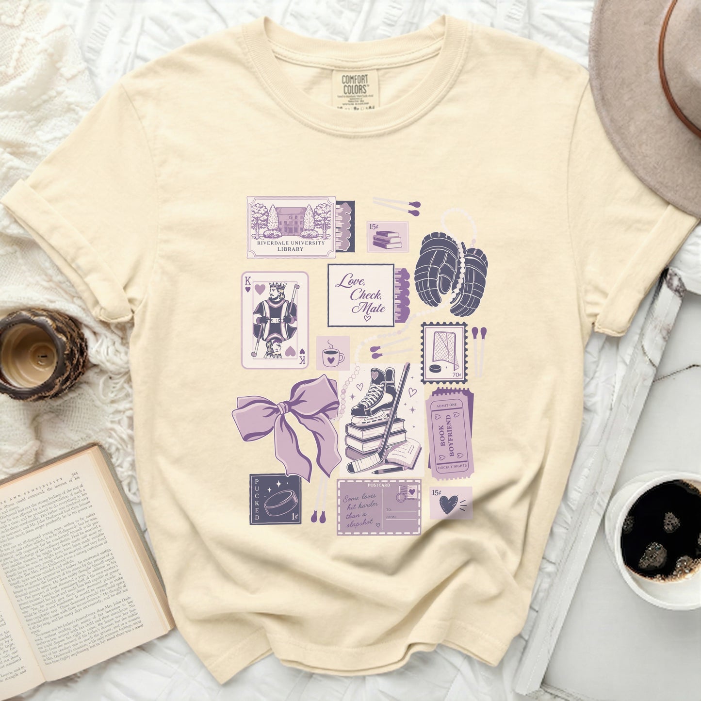 Cream t-shirt with vintage hockey-themed collage graphic.