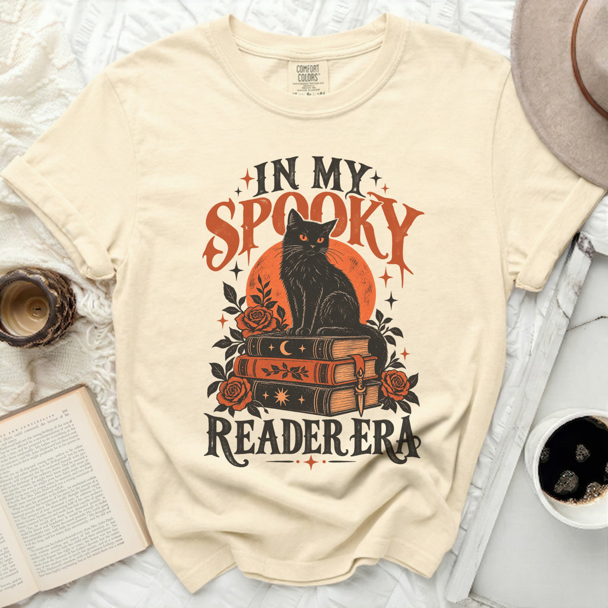 Black cat on books graphic with text "IN MY SPOOKY READER ERA".