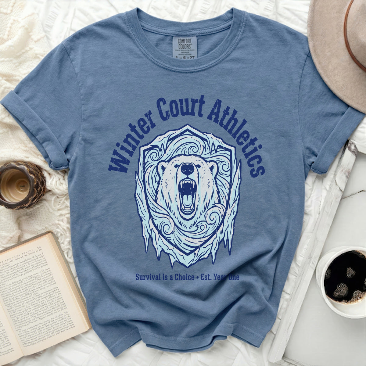 Blue t-shirt with polar bear shield graphic and "Winter Court Athletics" text.