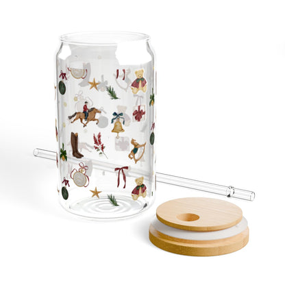Festive transparent glass with holiday motifs and straw