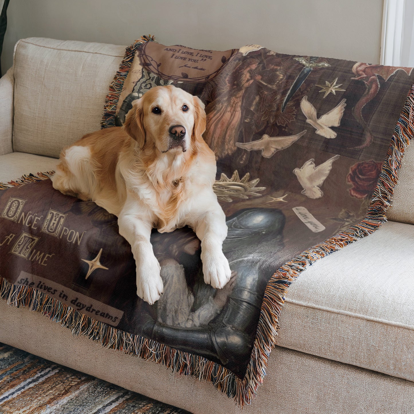 A golden retriever dog is lying on a couch, resting its head on a decorative blanket with a book-themed design.