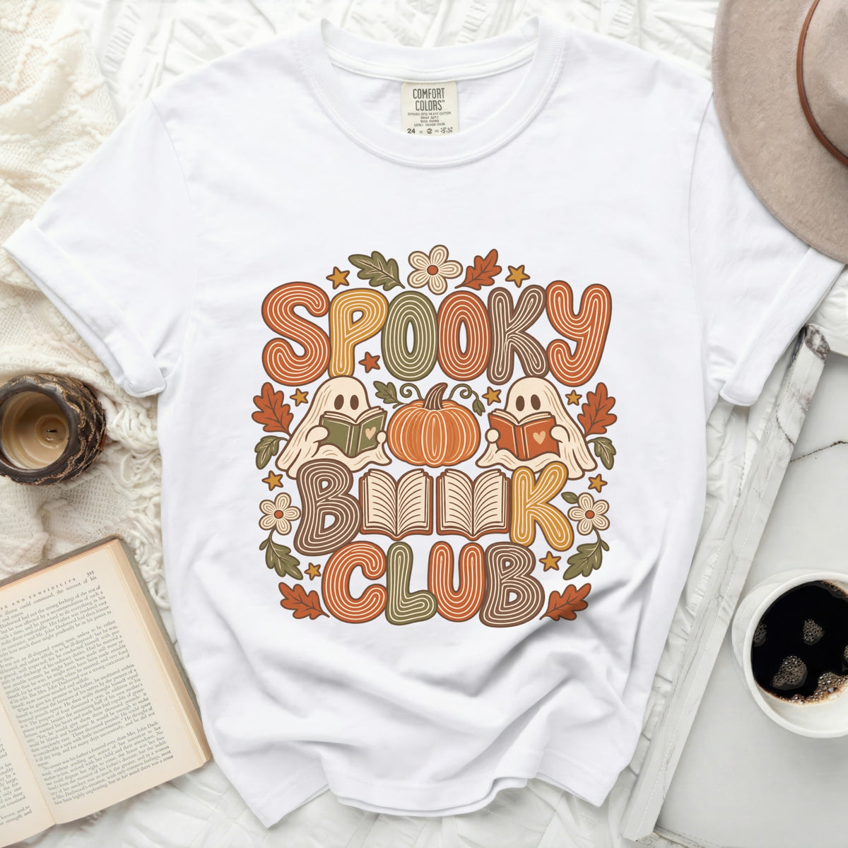 White t-shirt with "Spooky Book Club" text and Halloween graphic.