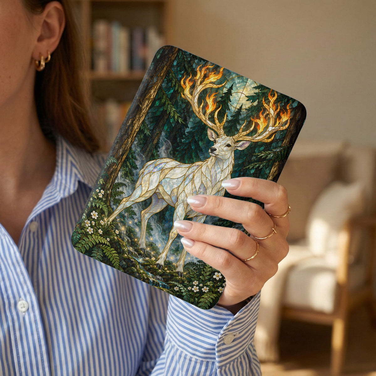 White stag with fiery antlers in a mystical forest scene on a book cover.