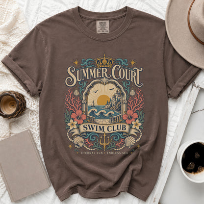 Brown t-shirt with "Summer Court Swim Club" vintage beach graphic and text.