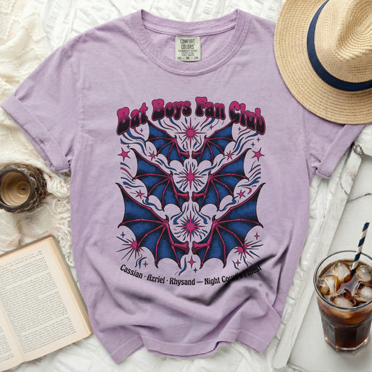 Lavender t-shirt with "Bat Boys Fan Club" text and bat wing graphic.