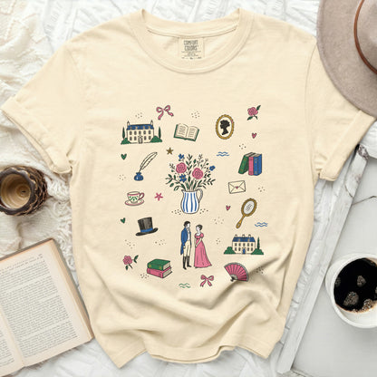 Cream t-shirt with a print of vintage illustrations including houses, books, and people.