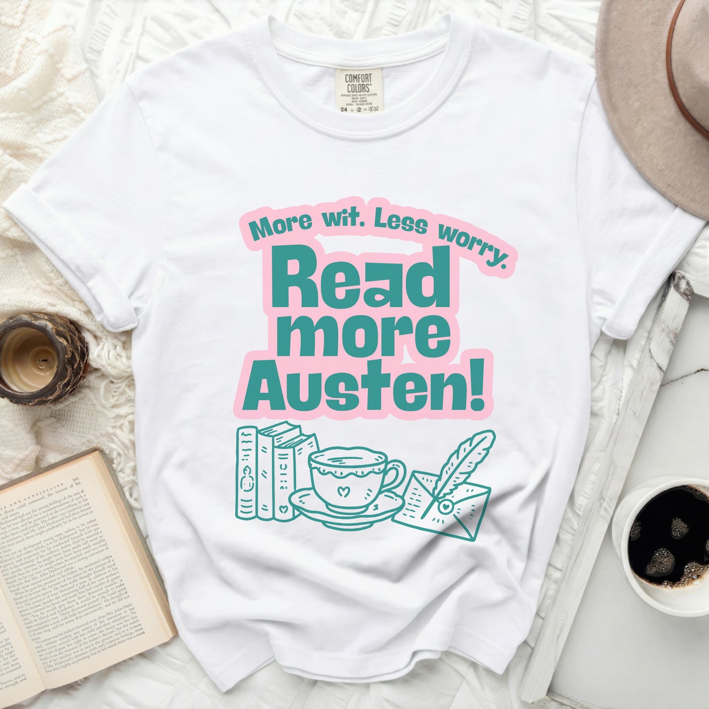 White t-shirt with "More wit. Less worry. Read more Austen!" text and book drawings.