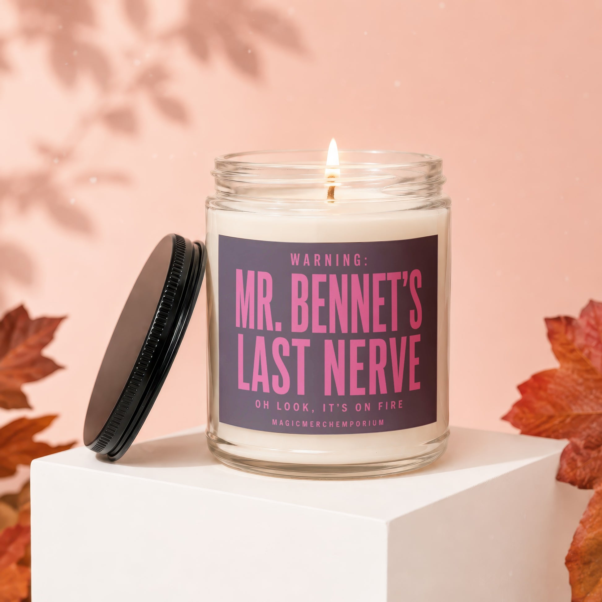 Lit glass candle with dark lid jar labeled "Mr. Bennet's Last Nerve".