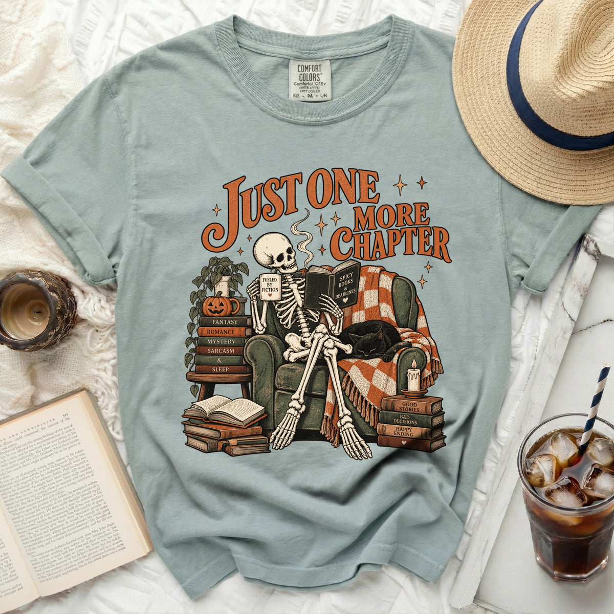 Skeleton reading a book with text "Just One More Chapter" and titles like "Fantasy" and "Romance."