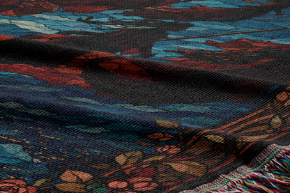 a close-up view of a colorful, textured fabric with a floral pattern. The fabric appears to be a textile or textile-like material, with a mix of blue, red, and orange colors. The fabric has a crumpled texture, giving it a soft and cozy appearance.