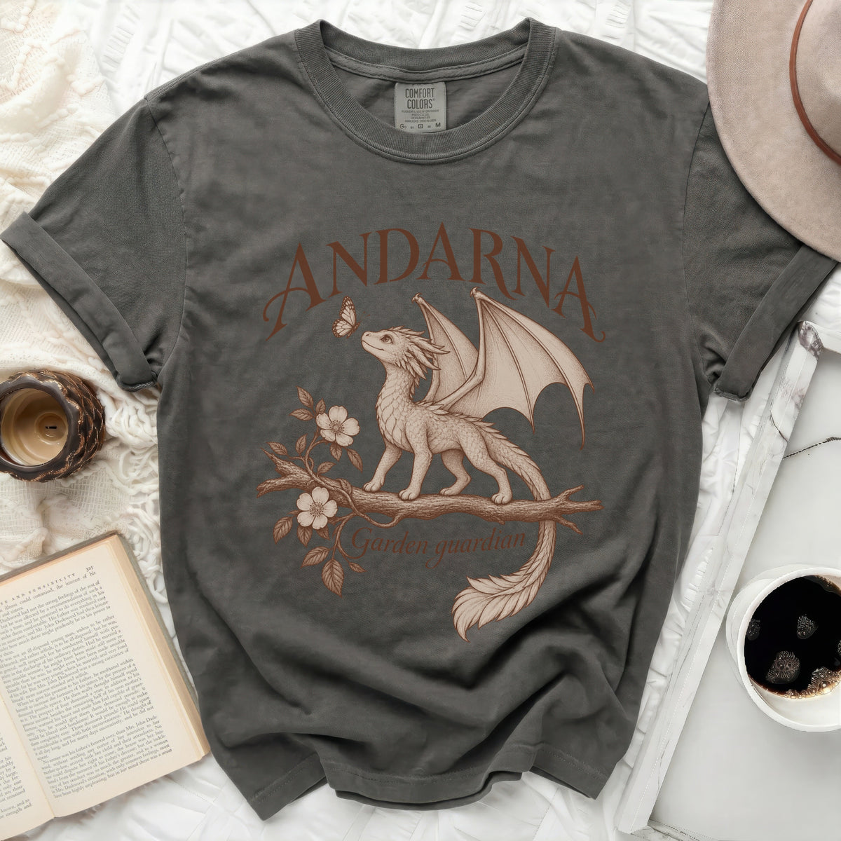 T-shirt with a dragon, butterfly, and text reading "ANDARNA Garden guardian".
