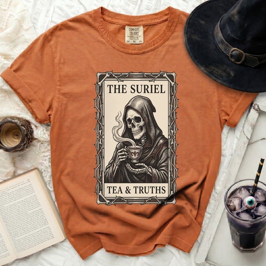 Orange t-shirt with grim reaper skeleton drinking tea and text "The Suriel Tea & Truths".