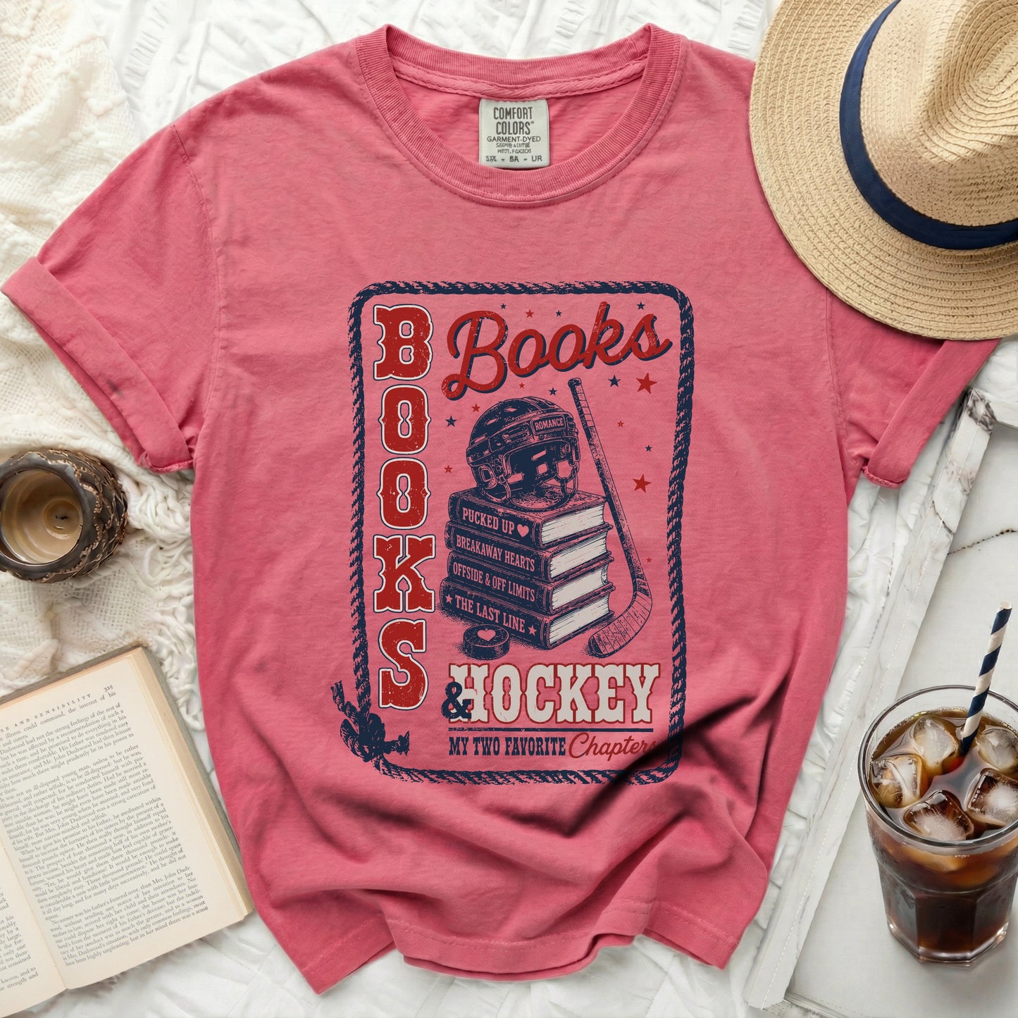 Red t-shirt with "Books & Hockey" graphic and book titles.