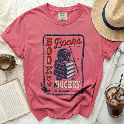 Red t-shirt with "Books & Hockey" graphic and book titles.