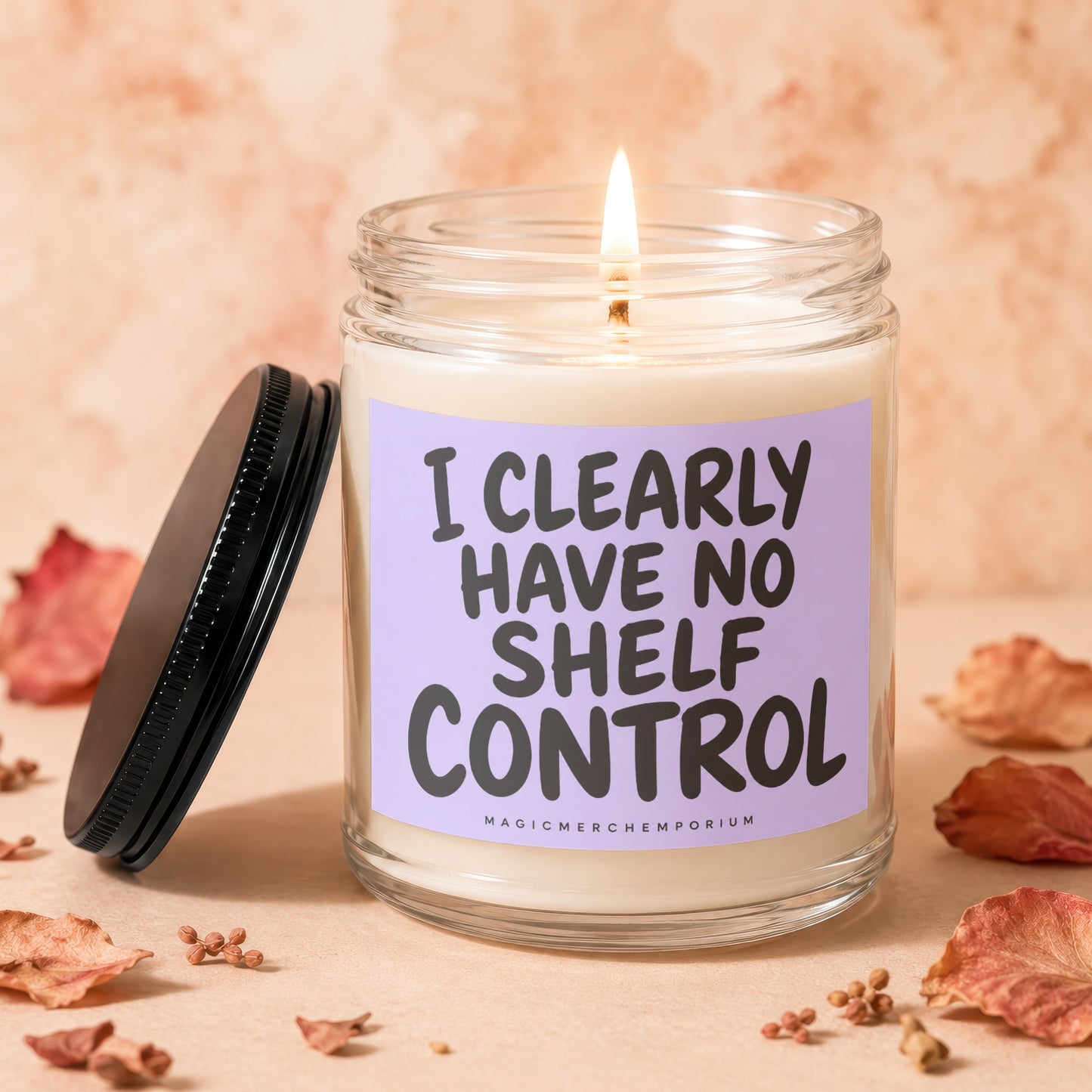 Jar candle with lavender label reading "I CLEARLY HAVE NO SHELF CONTROL."