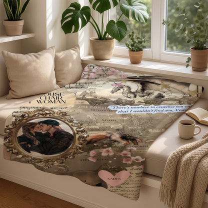 Dragon, couple, and map artwork on a blanket with text.