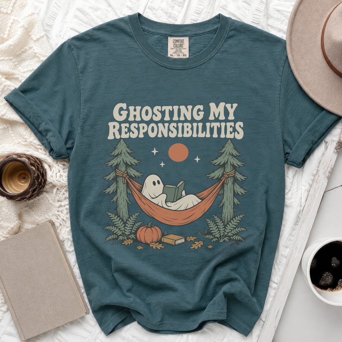 Teal t-shirt with ghost reading in hammock graphic and text "Ghosting My Responsibilities".