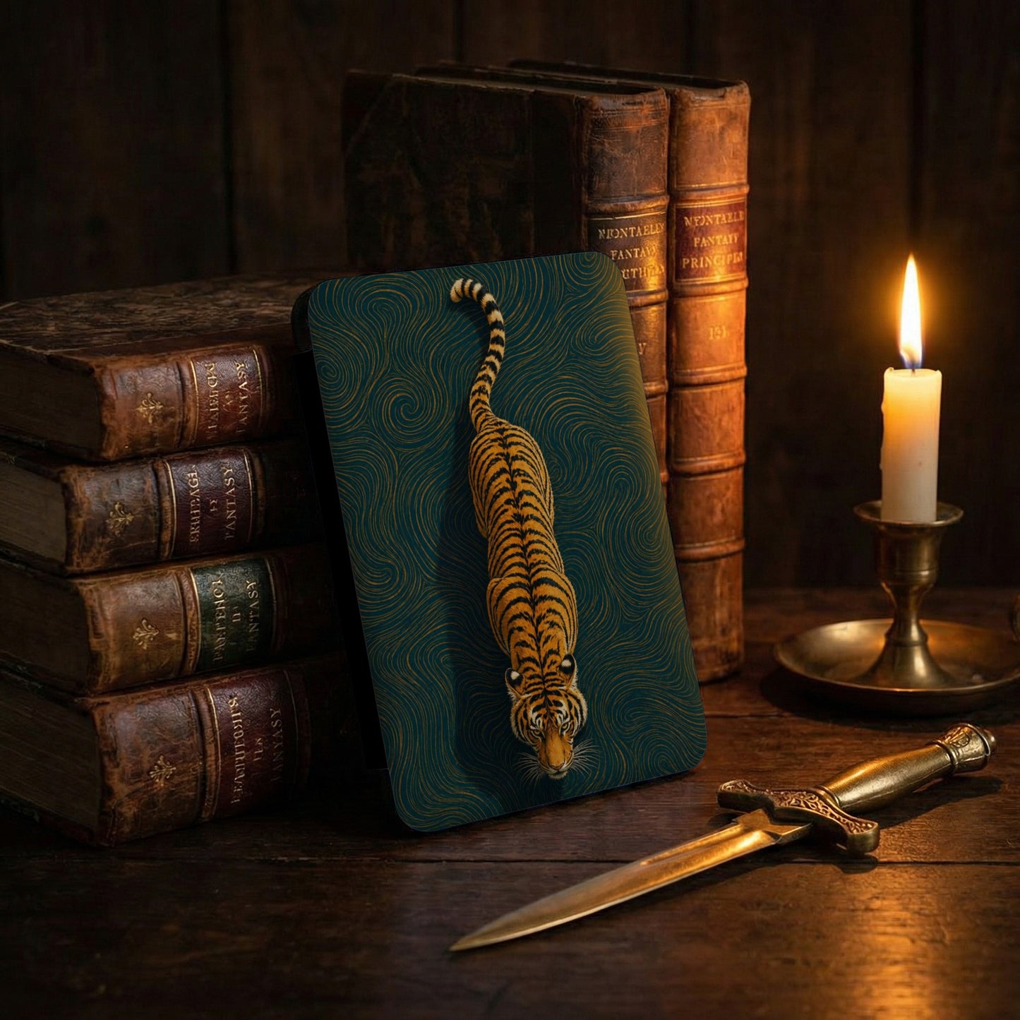 Tiger card with stylized waves art beside antique books and candle.