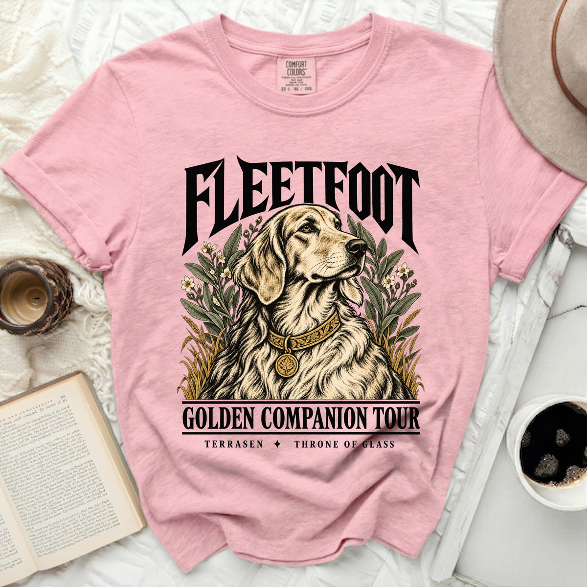 Pink t-shirt with golden retriever, "FLEETFOOT GOLDEN COMPANION TOUR TERRASEN THRONE OF GLASS" text.
