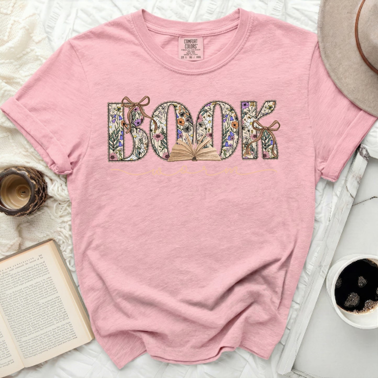 Pink t-shirt with "BOOK" in floral letters and an open book graphic.