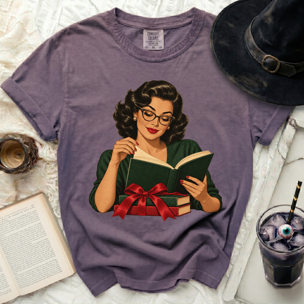 Vintage-style woman in glasses reading a book with a red ribbon.