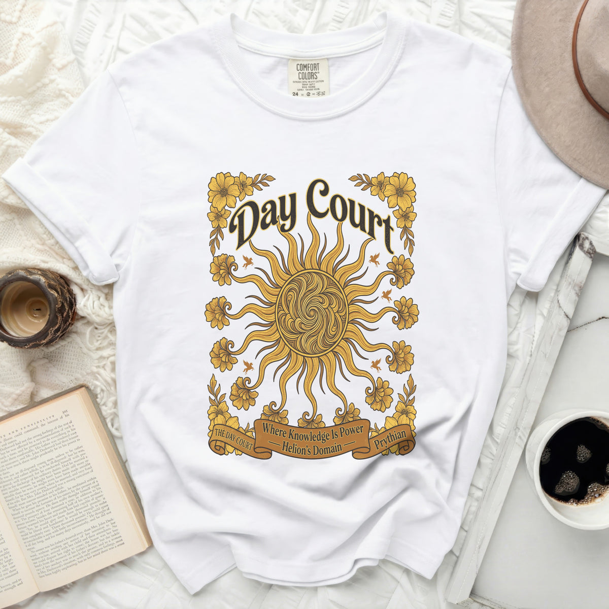 White Comfort Colors t-shirt with "Day Court" sun graphic and floral accents.