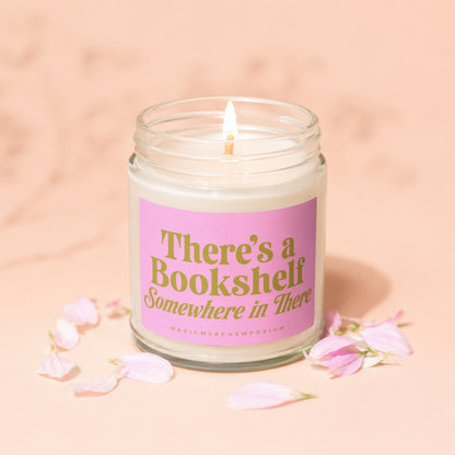 Candle with pink label reading "There's a Bookshelf Somewhere in There".