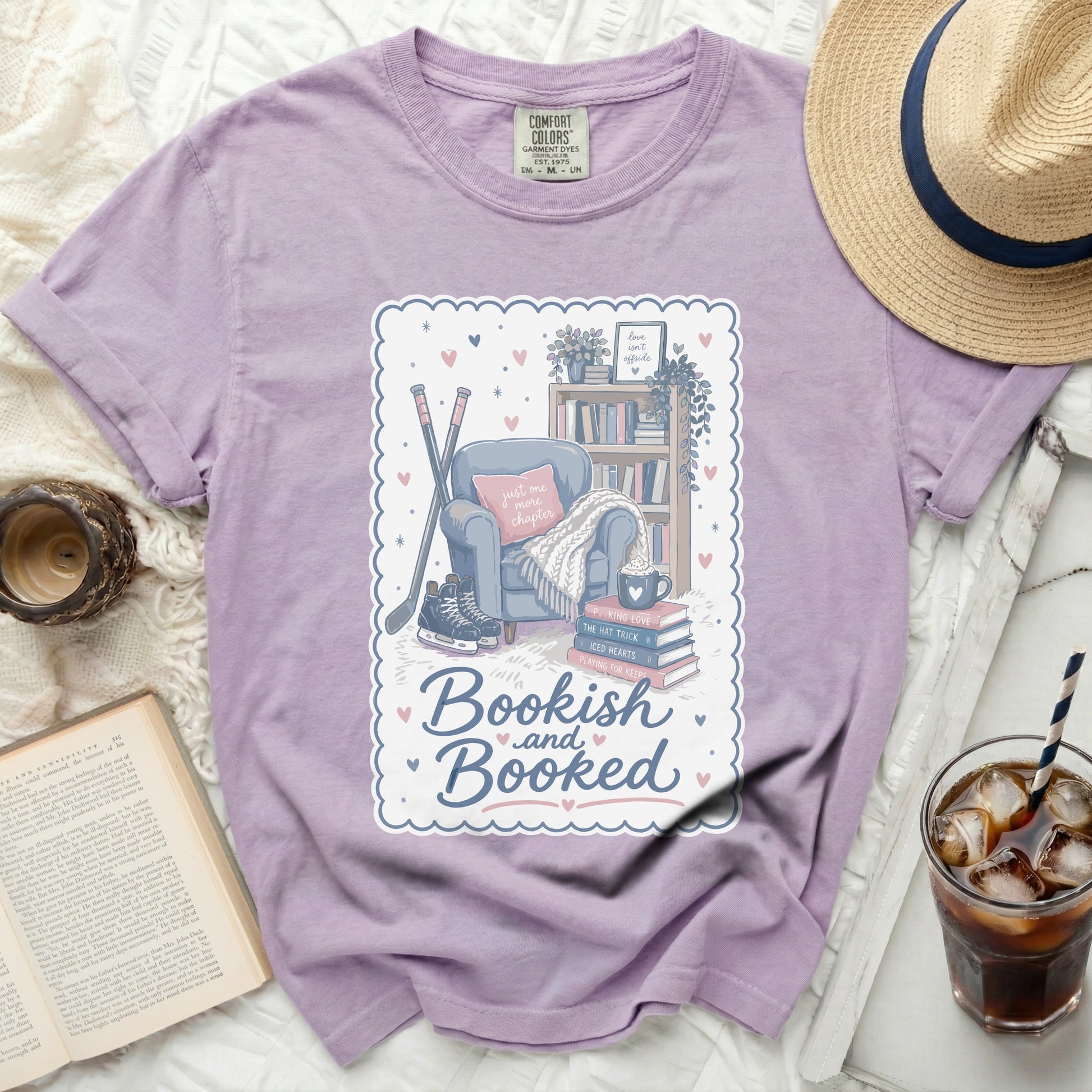 Comfort Colors t-shirt with "Bookish and Booked" graphic and reading-themed illustration.