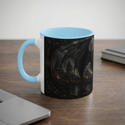 White mug with light blue handle featuring a dark, gothic castle and dragon wing design.