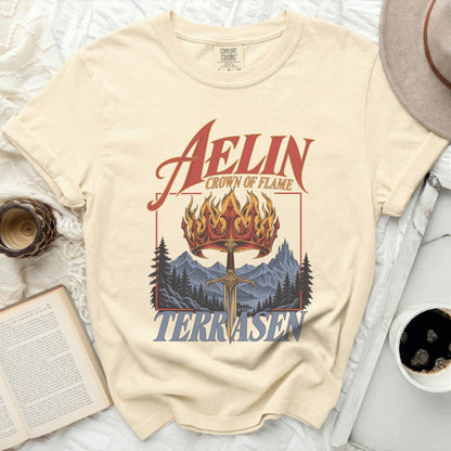 Cream t-shirt with "Aelin Crown of Flame Terrasen" graphic.