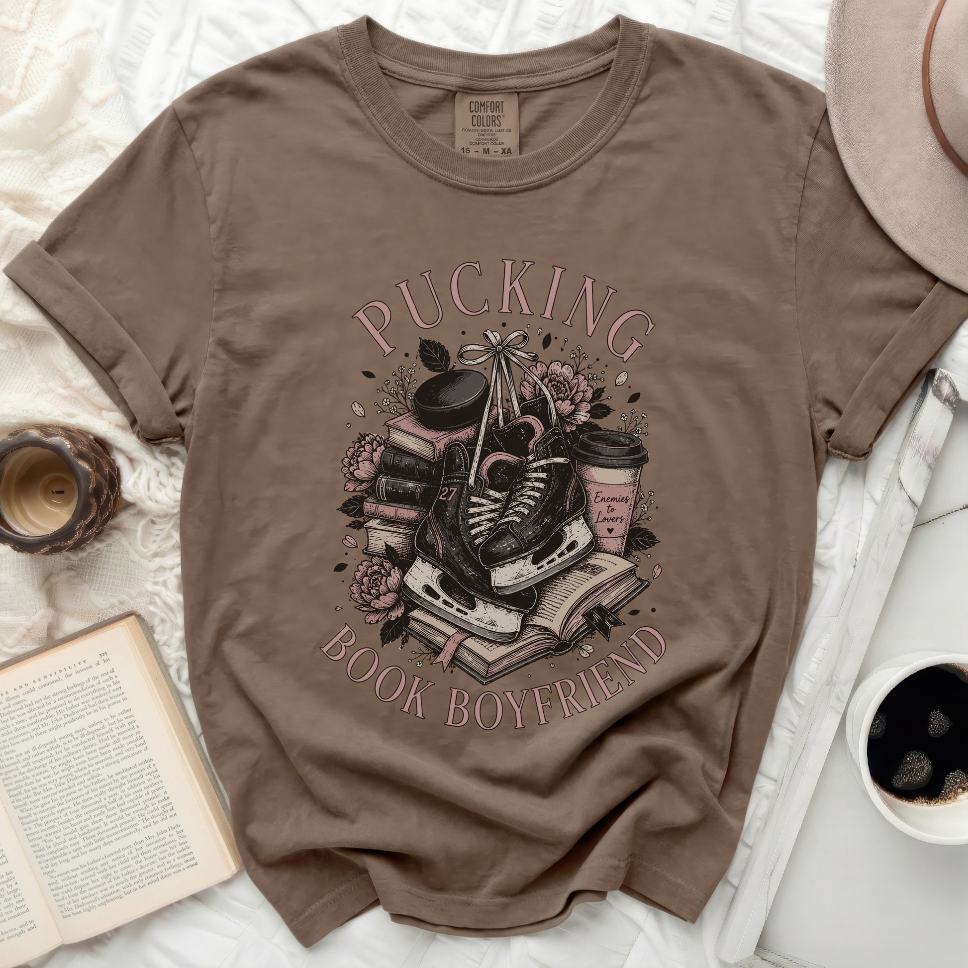 Brown t-shirt with "Pucking Book Boyfriend" text and hockey skates.