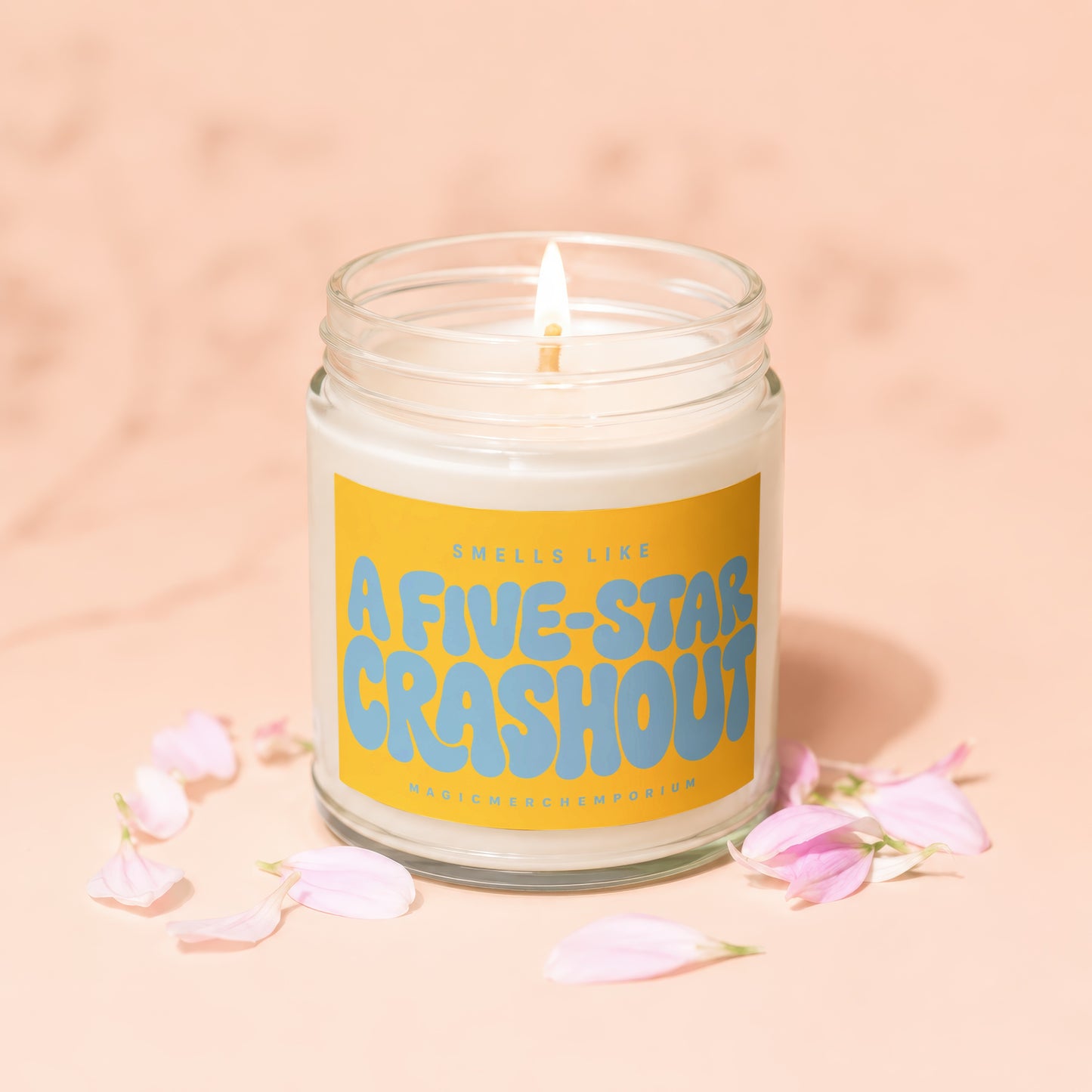 Jar candle with label that says "Smells Like A Five-Star Crashout" and "MagicMerchEmporium"