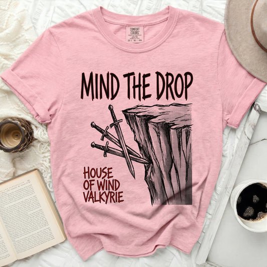 Pink t-shirt with "Mind the Drop House of Wind Valkyrie" graphic.