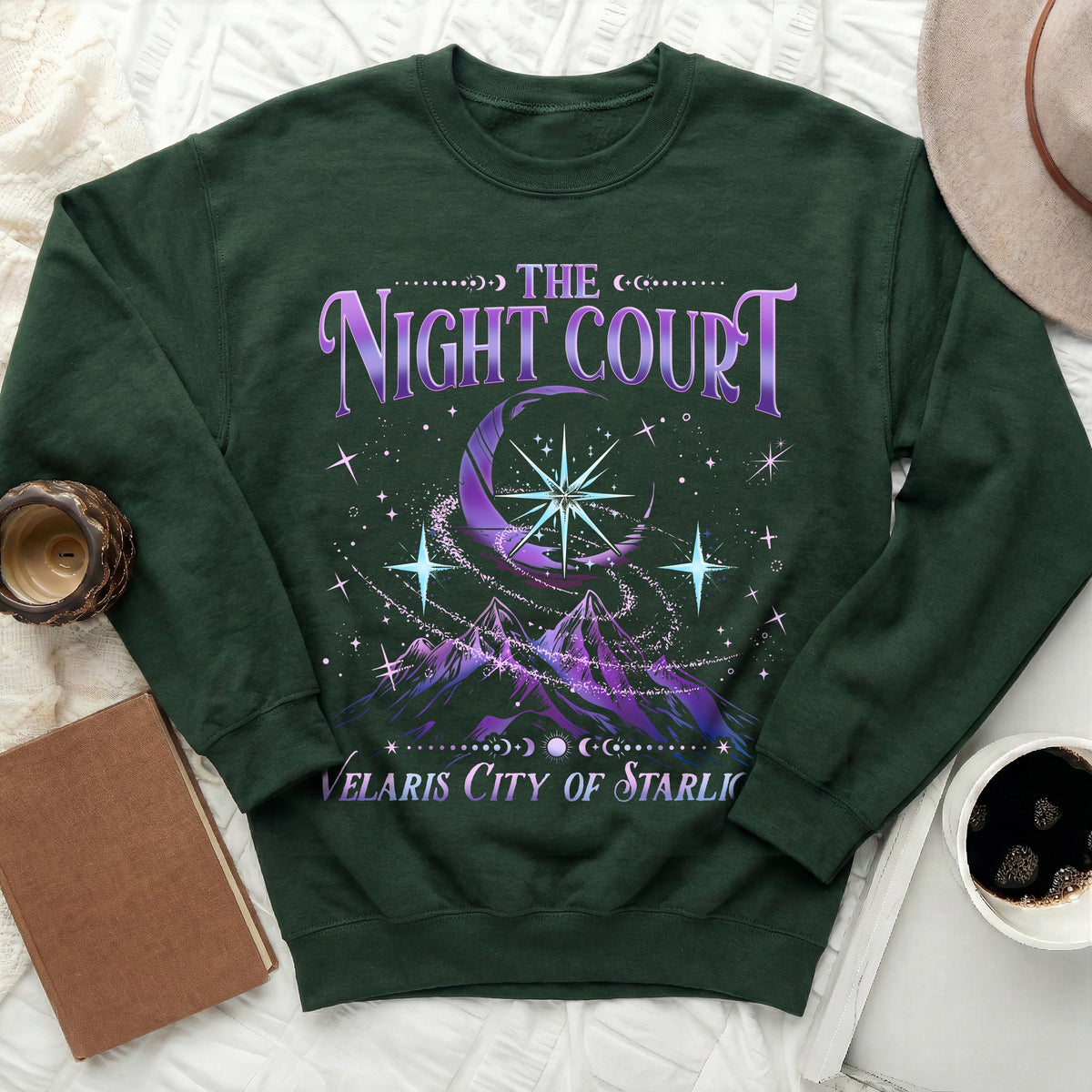 Green sweatshirt with "The Night Court Velaris City of Starlight" text and crescent moon graphic.