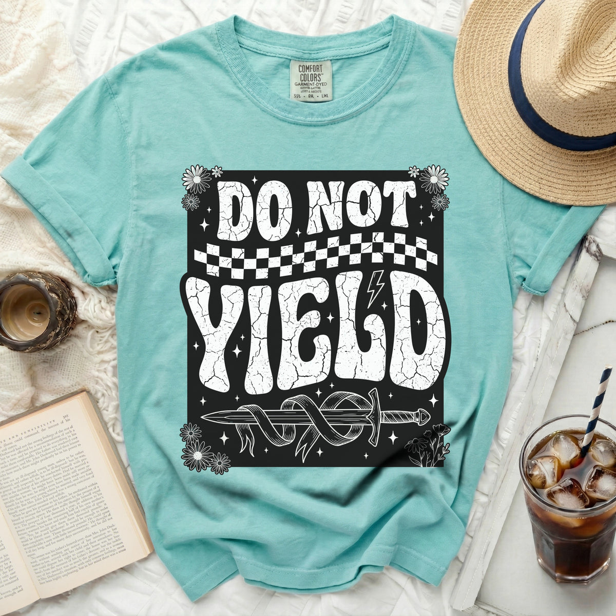 Turquoise t-shirt with "DO NOT YIELD" text and a sword graphic.