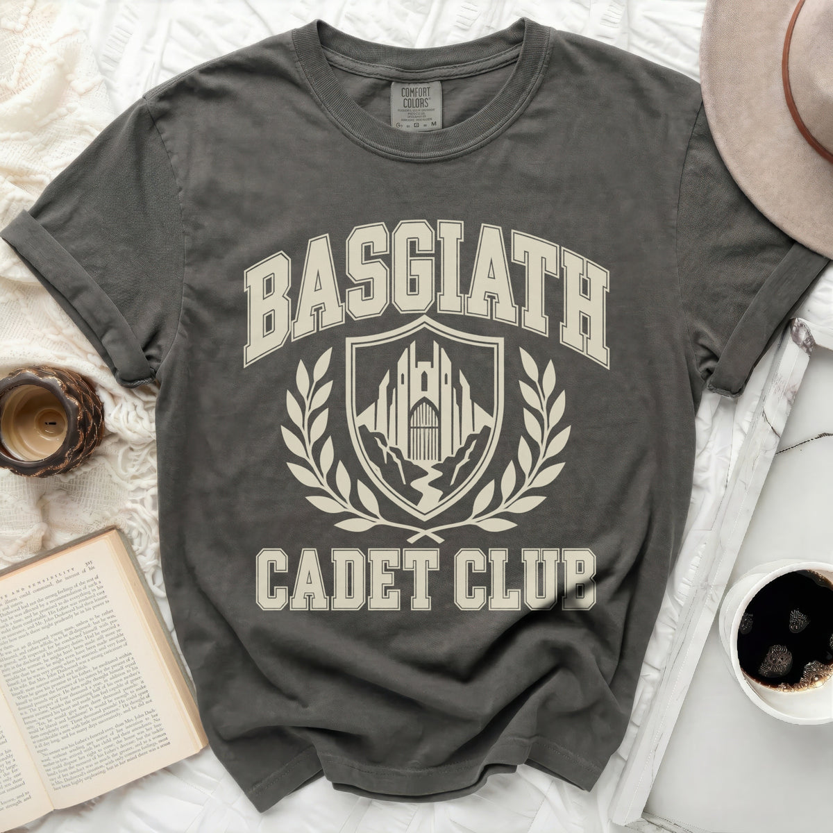Dark gray t-shirt with "Basgiath Cadet Club" text and crest graphic.