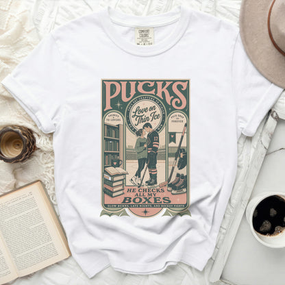 White t-shirt with "Love on Thin Ice" hockey graphic and text.