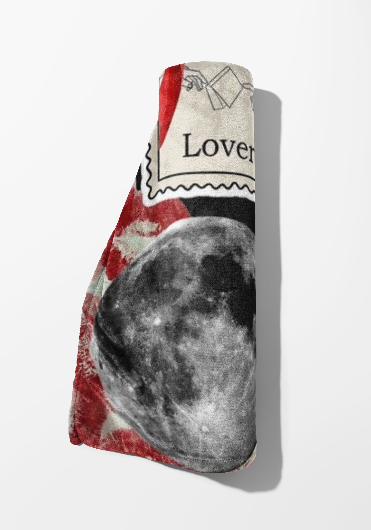 Rolled towel with moon, red, and "Lover" text design.