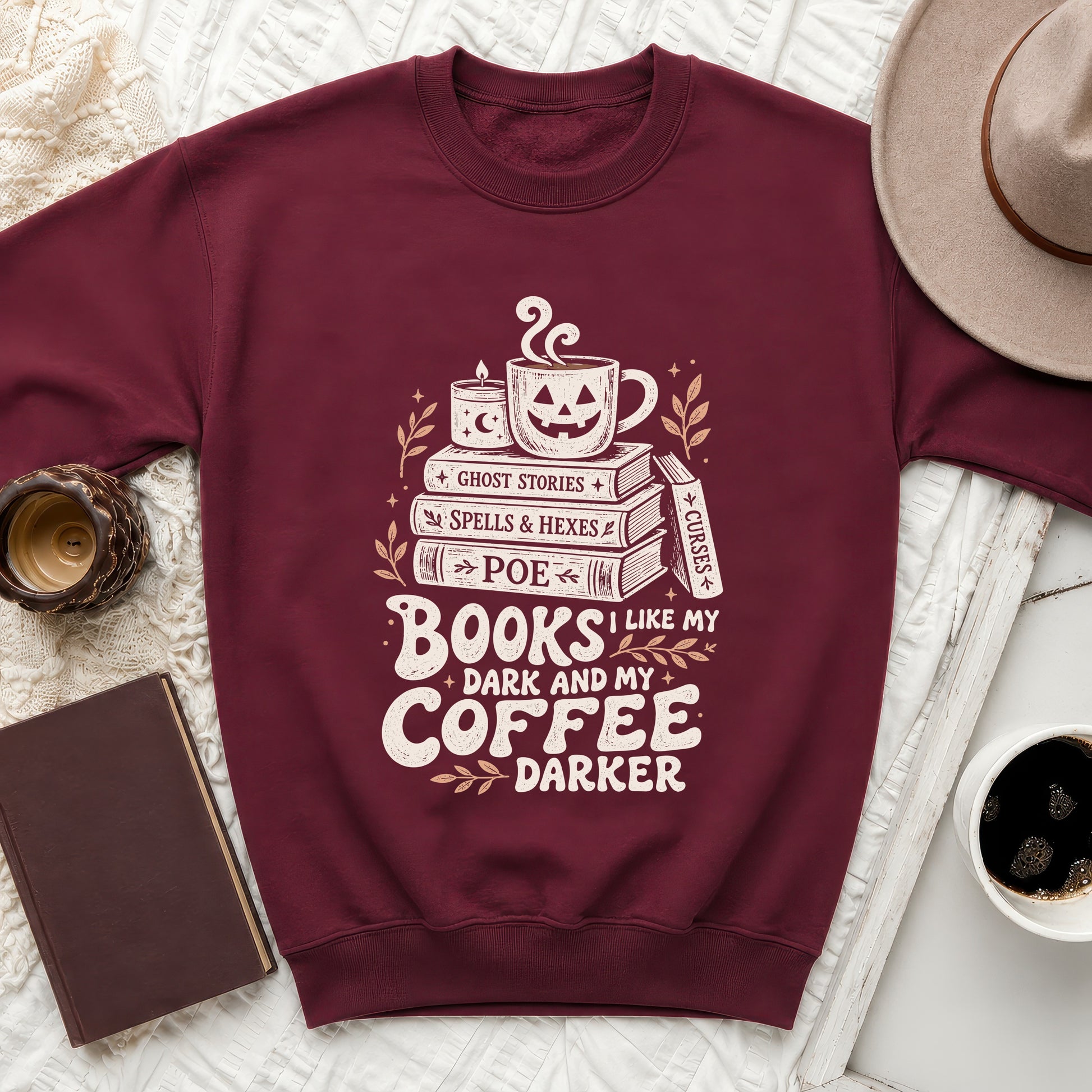 Maroon sweatshirt with graphic reading "Books I like my dark and my coffee darker."