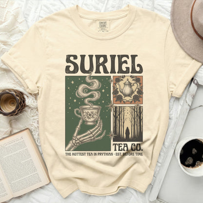 Cream t-shirt with Suriel Tea Co. and skeleton hand holding teacup design.