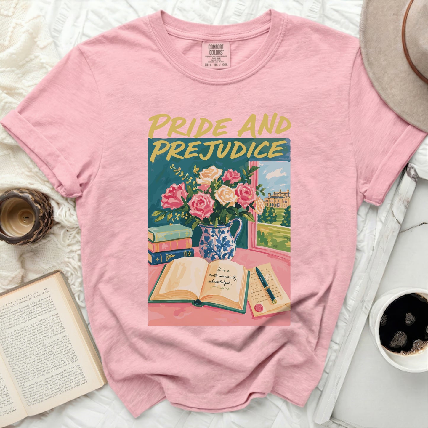 Pink t-shirt with "Pride and Prejudice" book art and floral design.