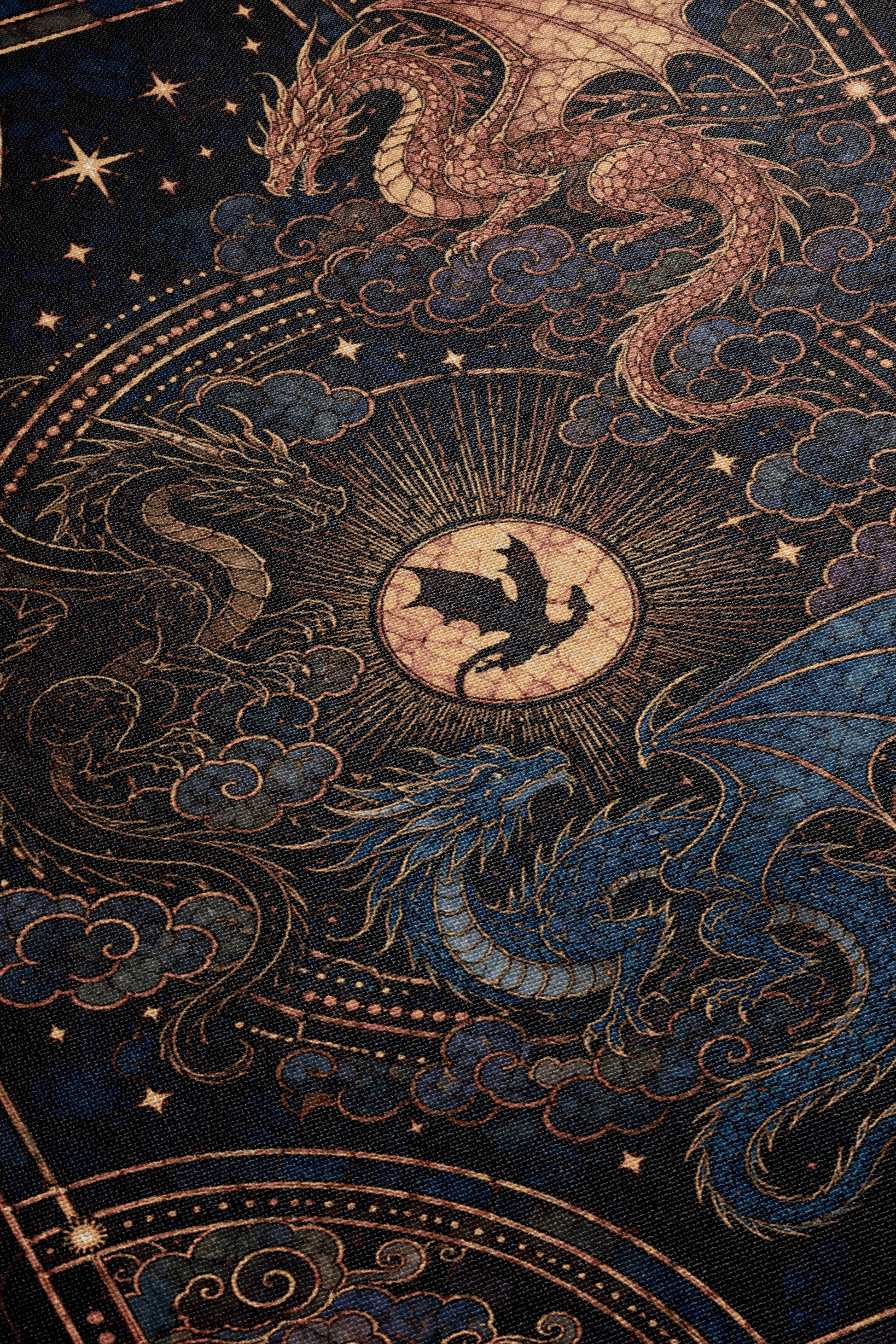 The image is a detailed and intricate illustration featuring a large, ornate dragon with a golden sunburst at its center, surrounded by smaller dragons and celestial elements such as stars and clouds.