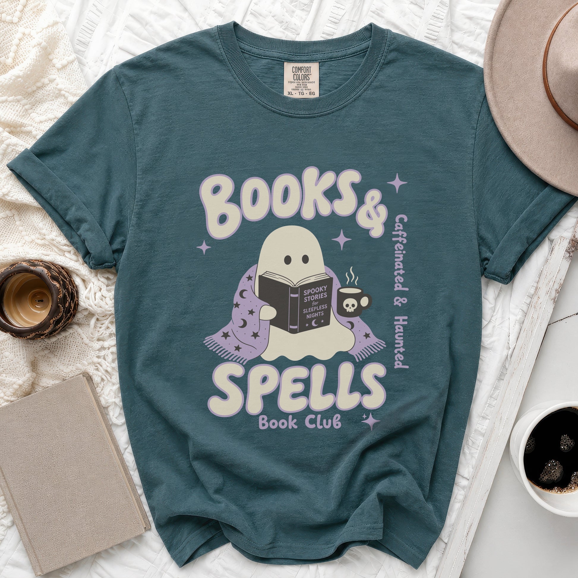 Teal t-shirt with ghost reading a book plus "Books & Spells Book Club" text.