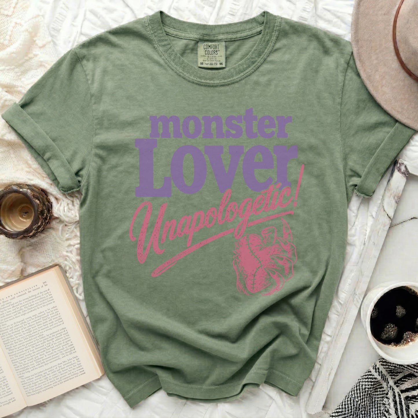Green t-shirt with "monster lover unapologetic" and heart design.