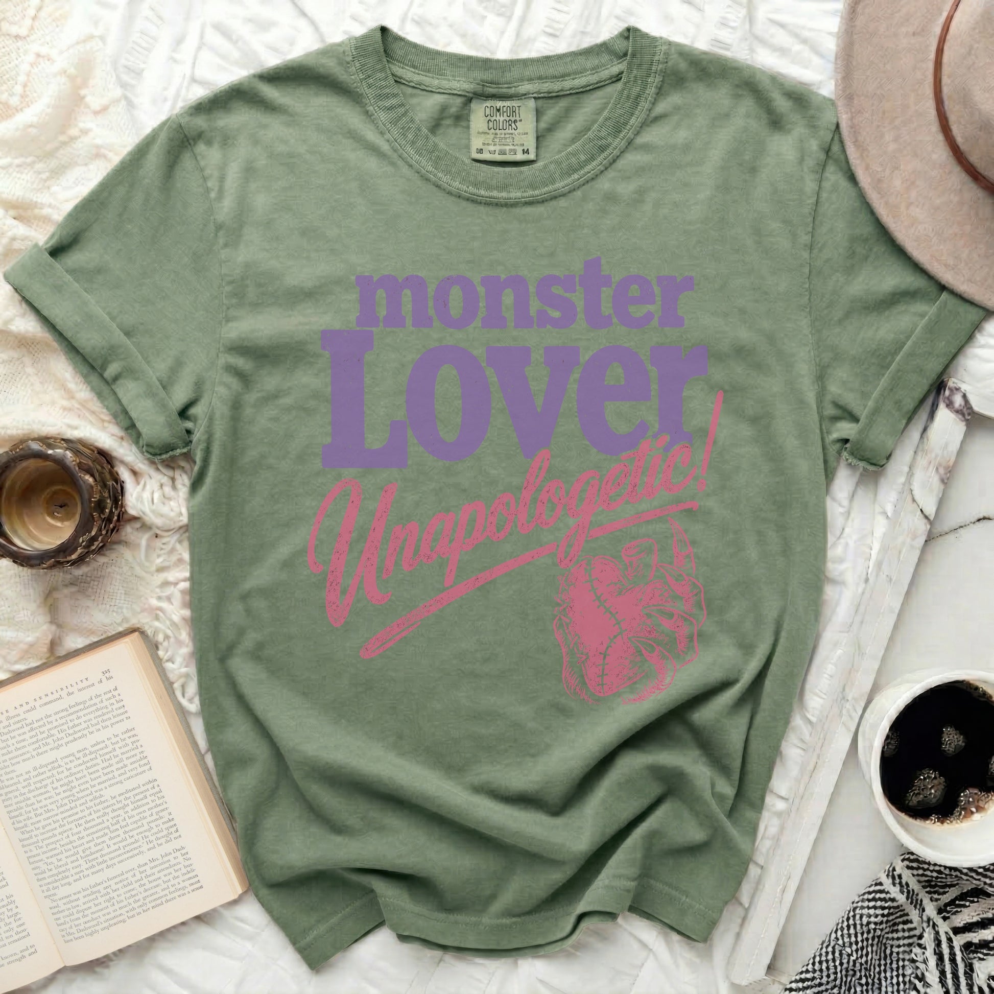 Green t-shirt with "monster lover unapologetic" and heart design.