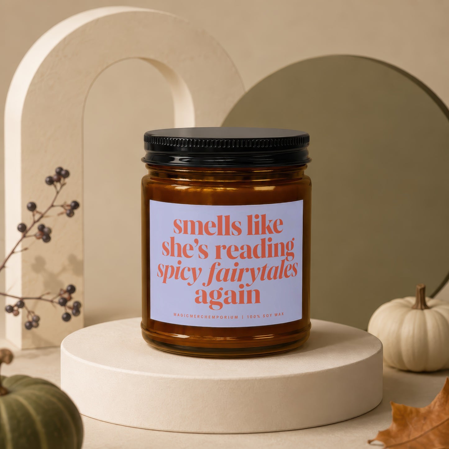Amber jar candle with black lid, reads "smells like she's reading spicy fairytales again".