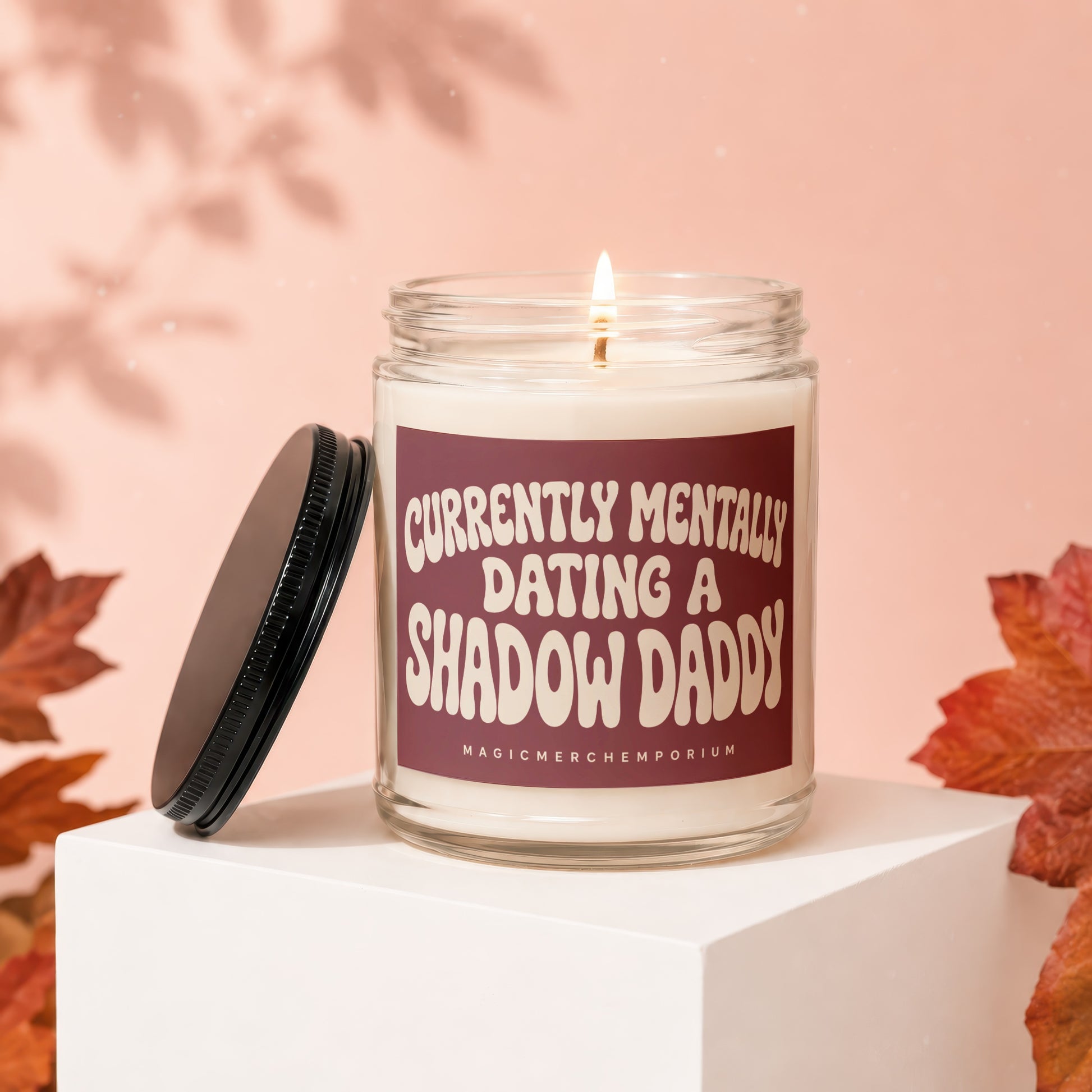 Lit candle in jar with "Currently Mentally Dating A Shadow Daddy" text on label.