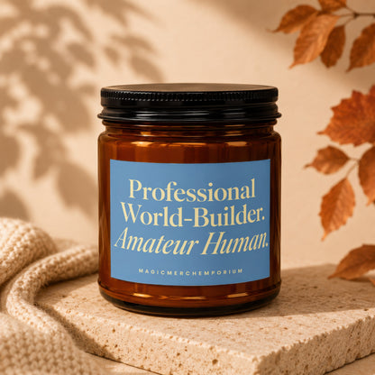 Amber jar candle with a blue label reading "Professional World-Builder. Amateur Human."