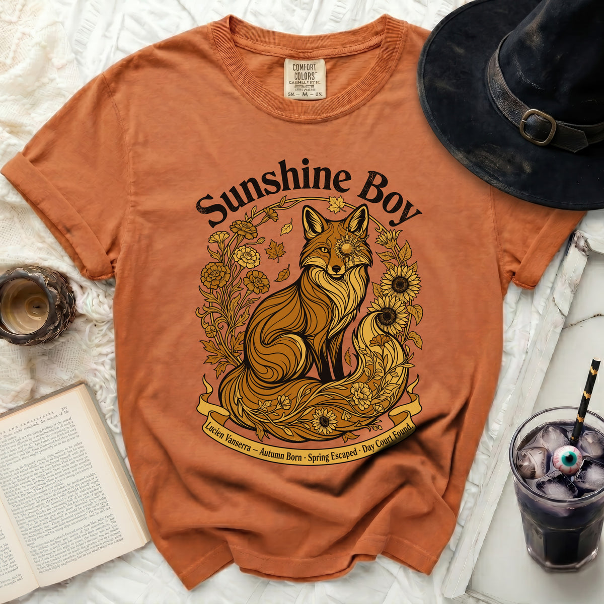 Orange t-shirt with "Sunshine Boy" text and a fox surrounded by flowers.