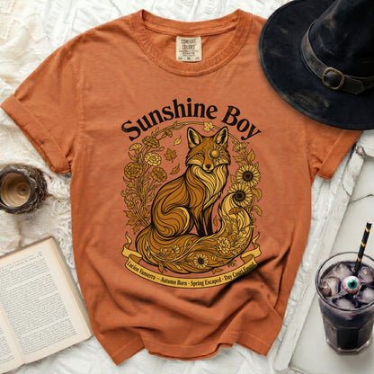 Orange t-shirt with "Sunshine Boy" text and a fox surrounded by flowers.